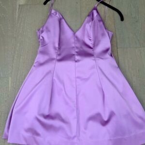 Bebe lilac satin dress has some tears on the strap size S